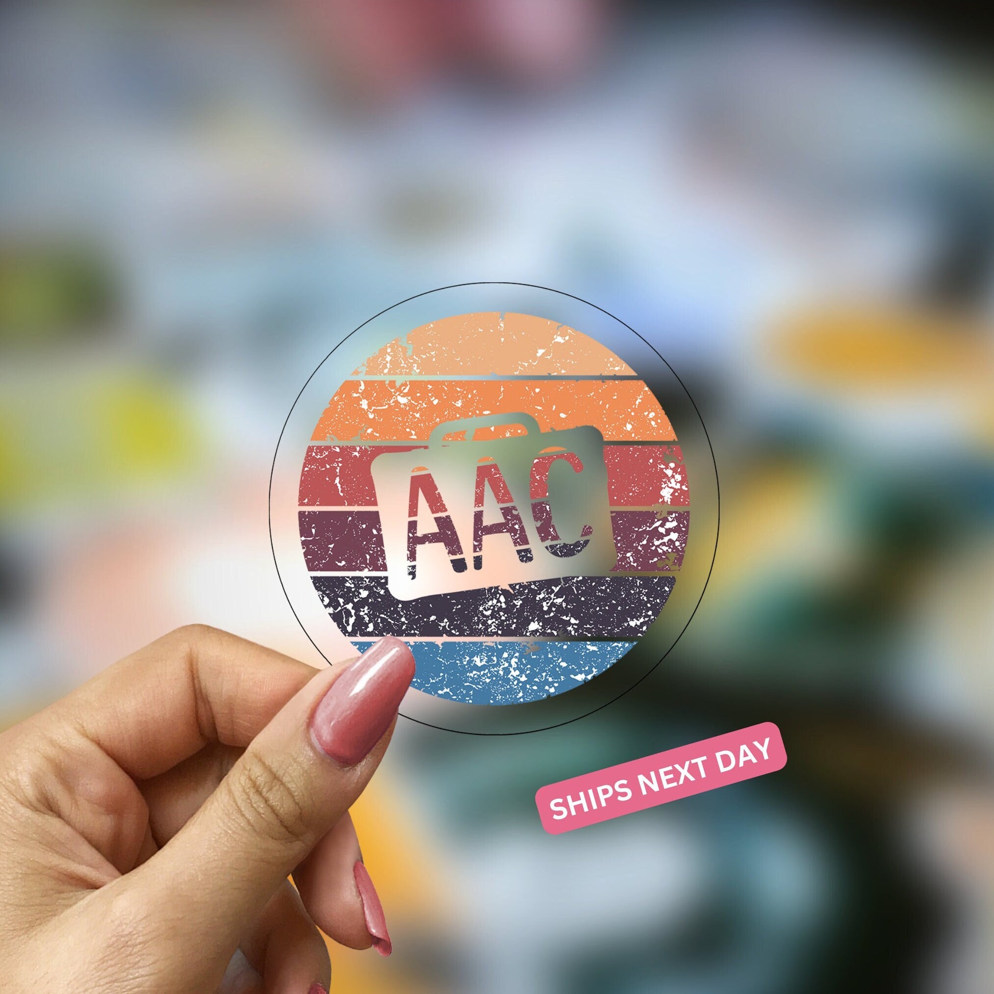 Speech therapist is holding a clear decal with retro colors with a device cutout and AAC written in the center of this SLP sticker.