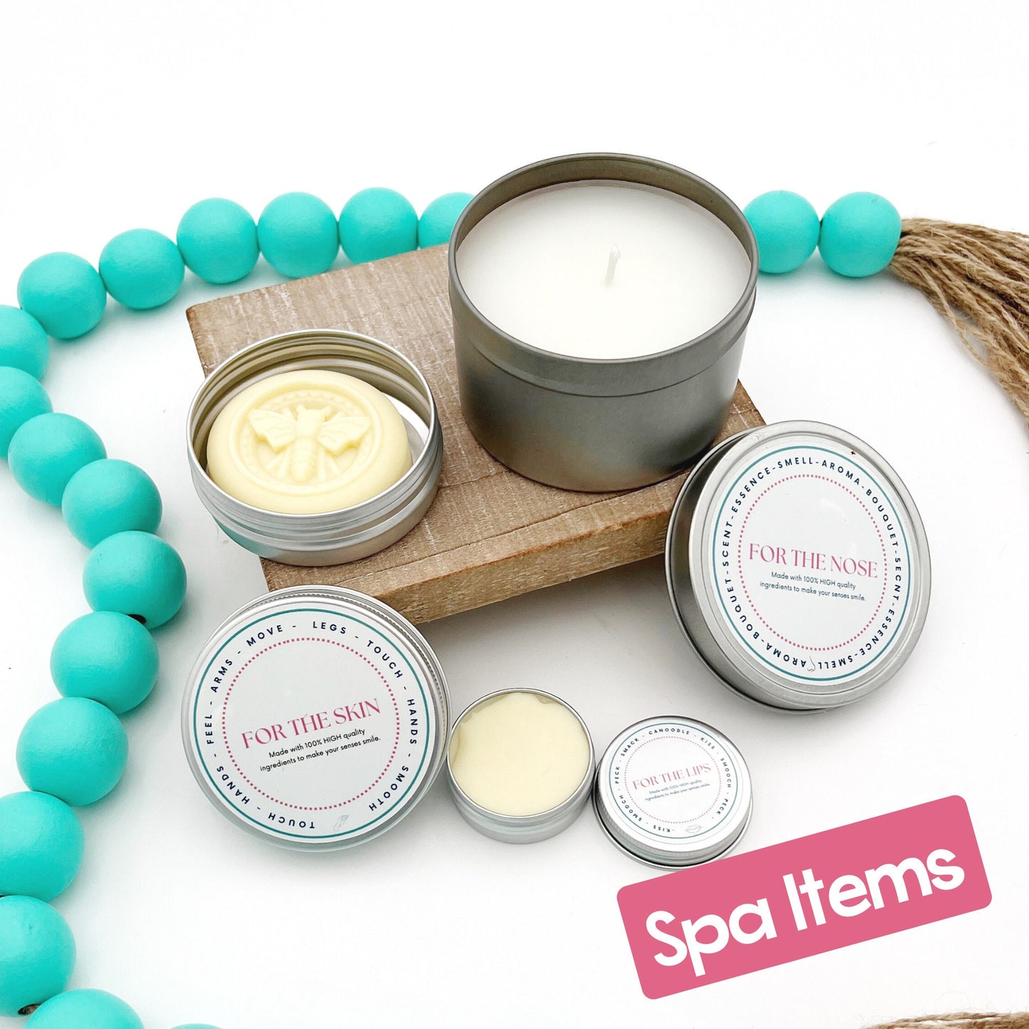 lip balm, candle, and lotion bar on a wooden riser.